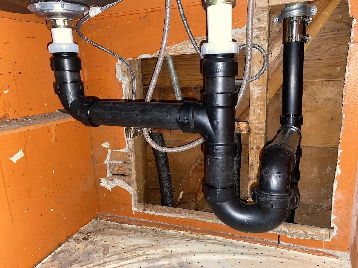 Professional Garbage Disposal Repair equipment and tools on the job in Shorewood
